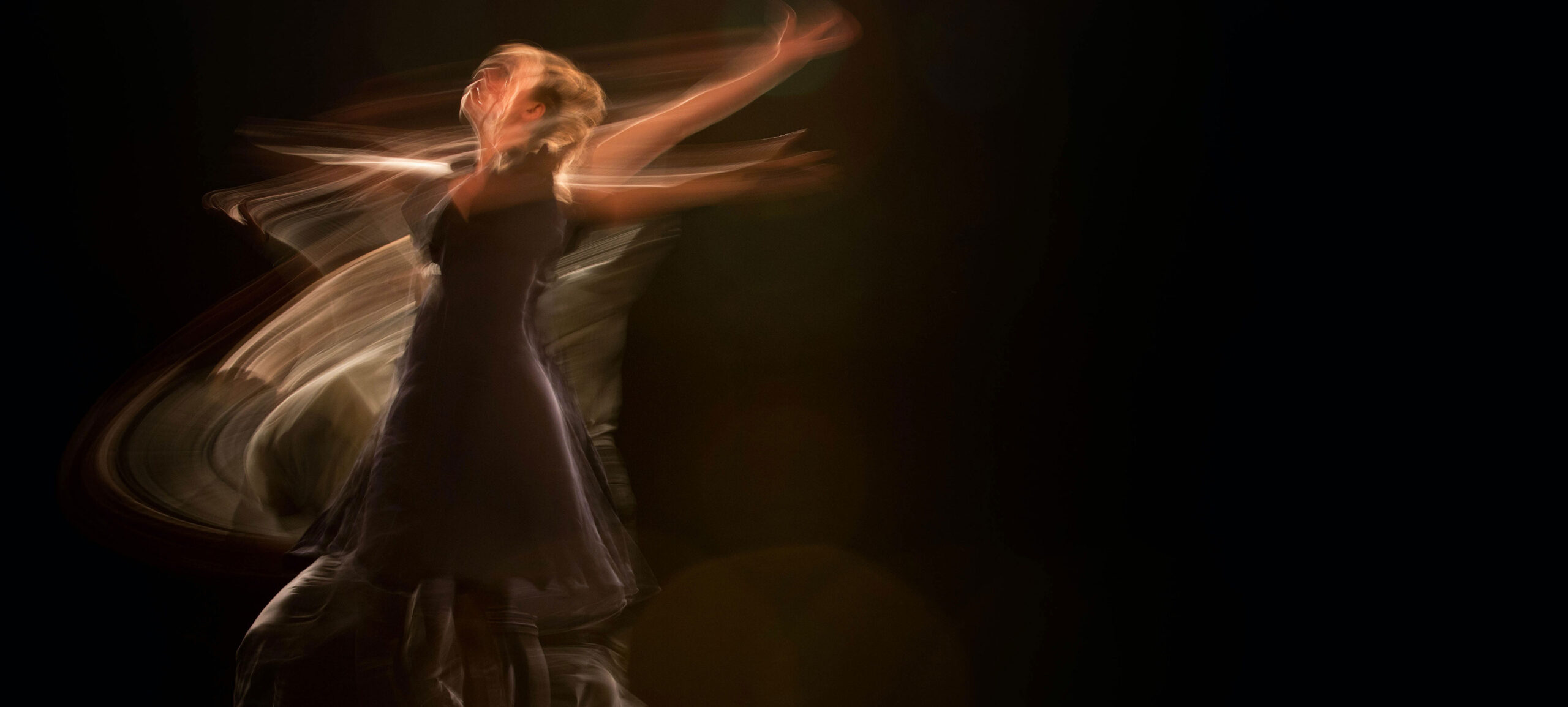 Person Doing Ballet with Black Background